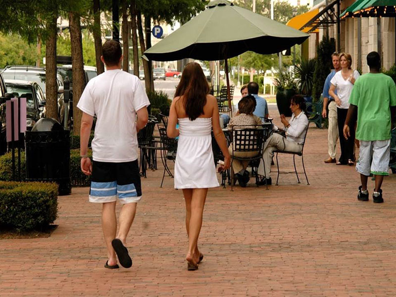 People Walking on a Sidewalk