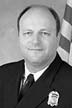 black and white photo of head picture for fire chief conneally