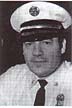 black and white photo of head picture for fire chief perino