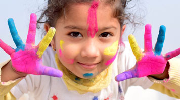 Image of girl with colorful face and hands